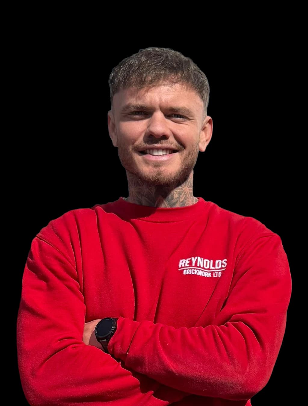 Ben Reynolds, Director and Lead Bricklayer at Reynolds Brickwork, in branded workwear in Bridgend