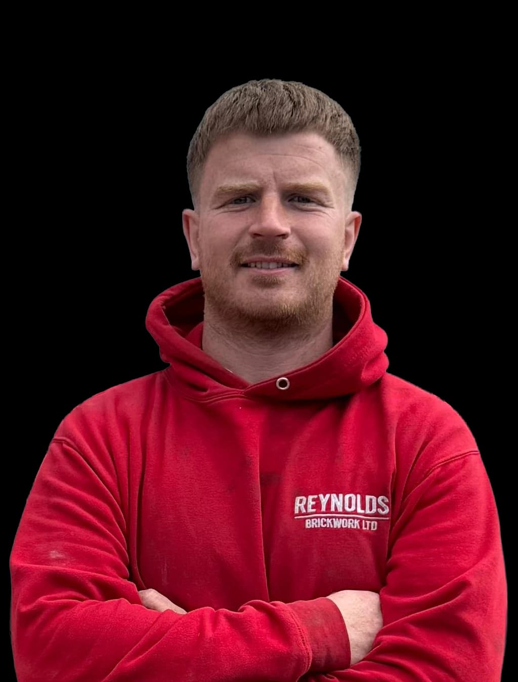 Rhys Jones, Site Manager and Bricklayer at Reynolds Brickwork, in branded workwear in Porthcawl